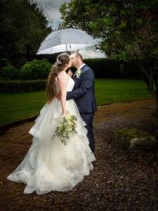 bride with umbrella at the higher trapp simonstone