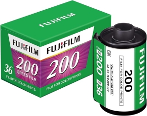 Fujifilm color print film box and compatible 200-speed film roll side by side. 36 exposures on the box; green packaging and white label.