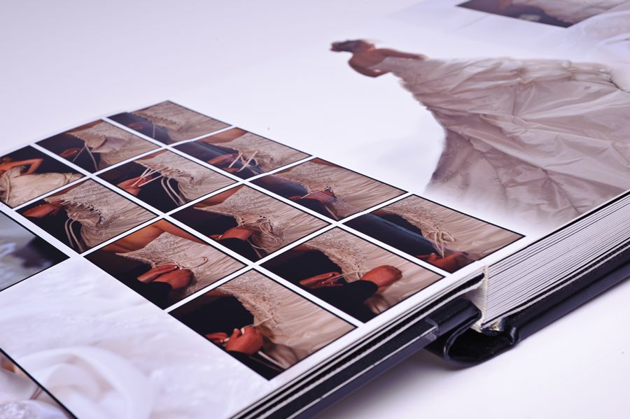 D3A_9233-copy | Weddings by Michael Open wedding photo album showing a grid of square thumbnail images on glossy pages
